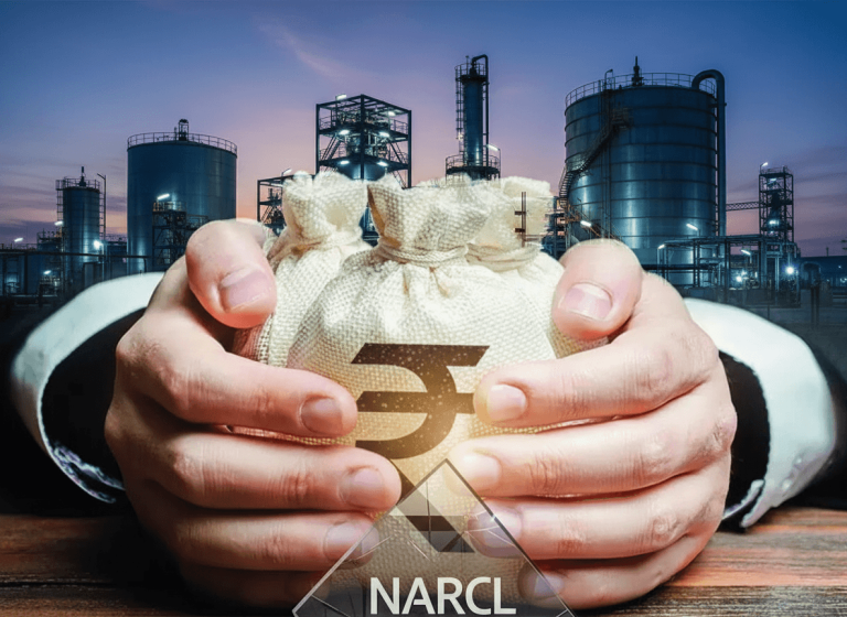 Hands holding a money bag with a rupee symbol, superimposed on an industrial facility at dusk, with "NARCL" text.